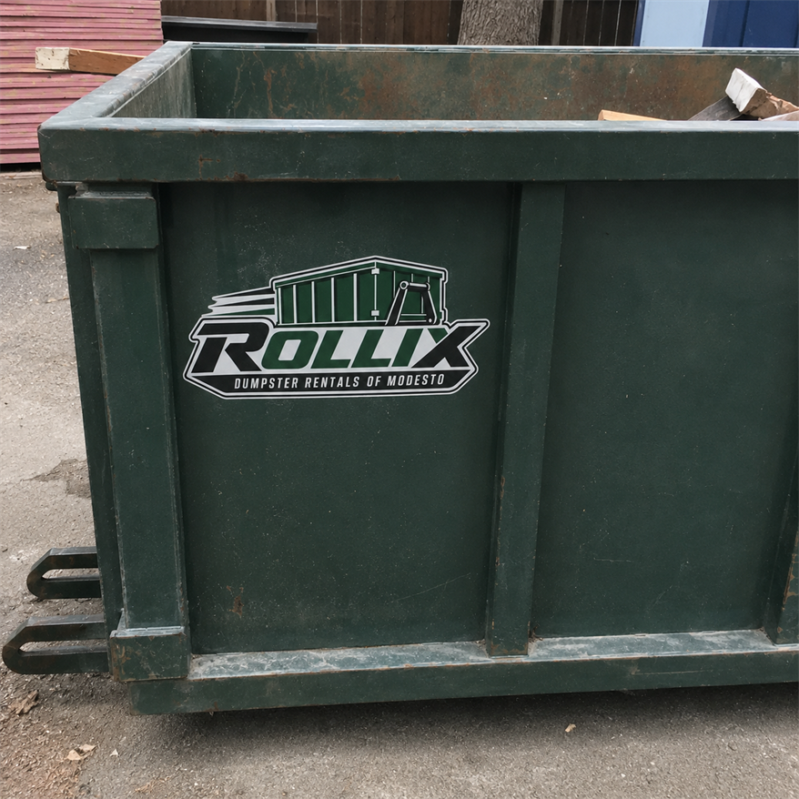 Close-up of a green Rollix roll-off dumpster